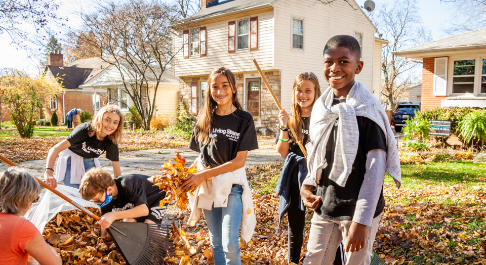Community Fundraising kids raking leaves