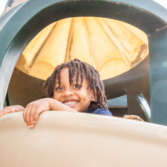 young boy on a slide