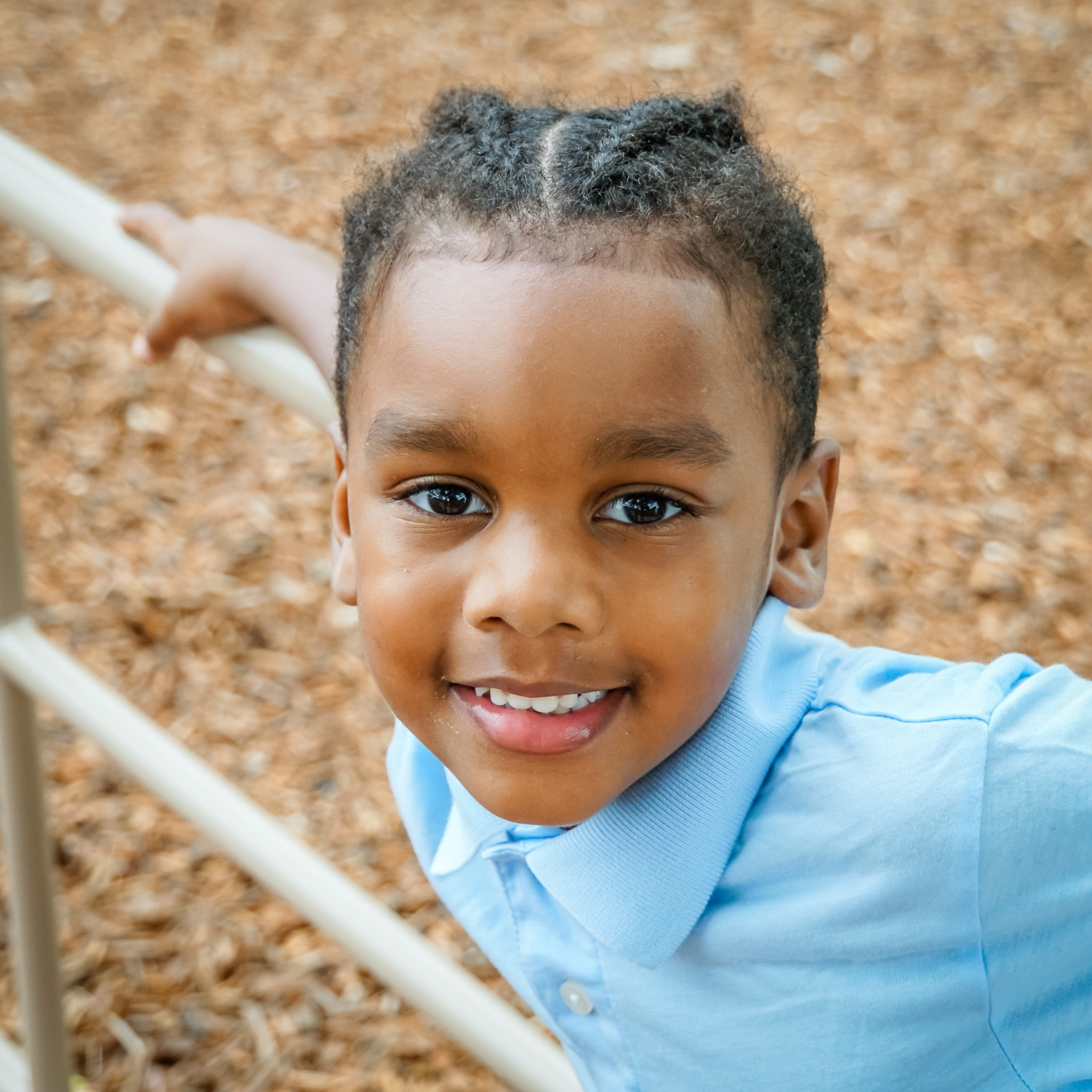 young boy on a slide